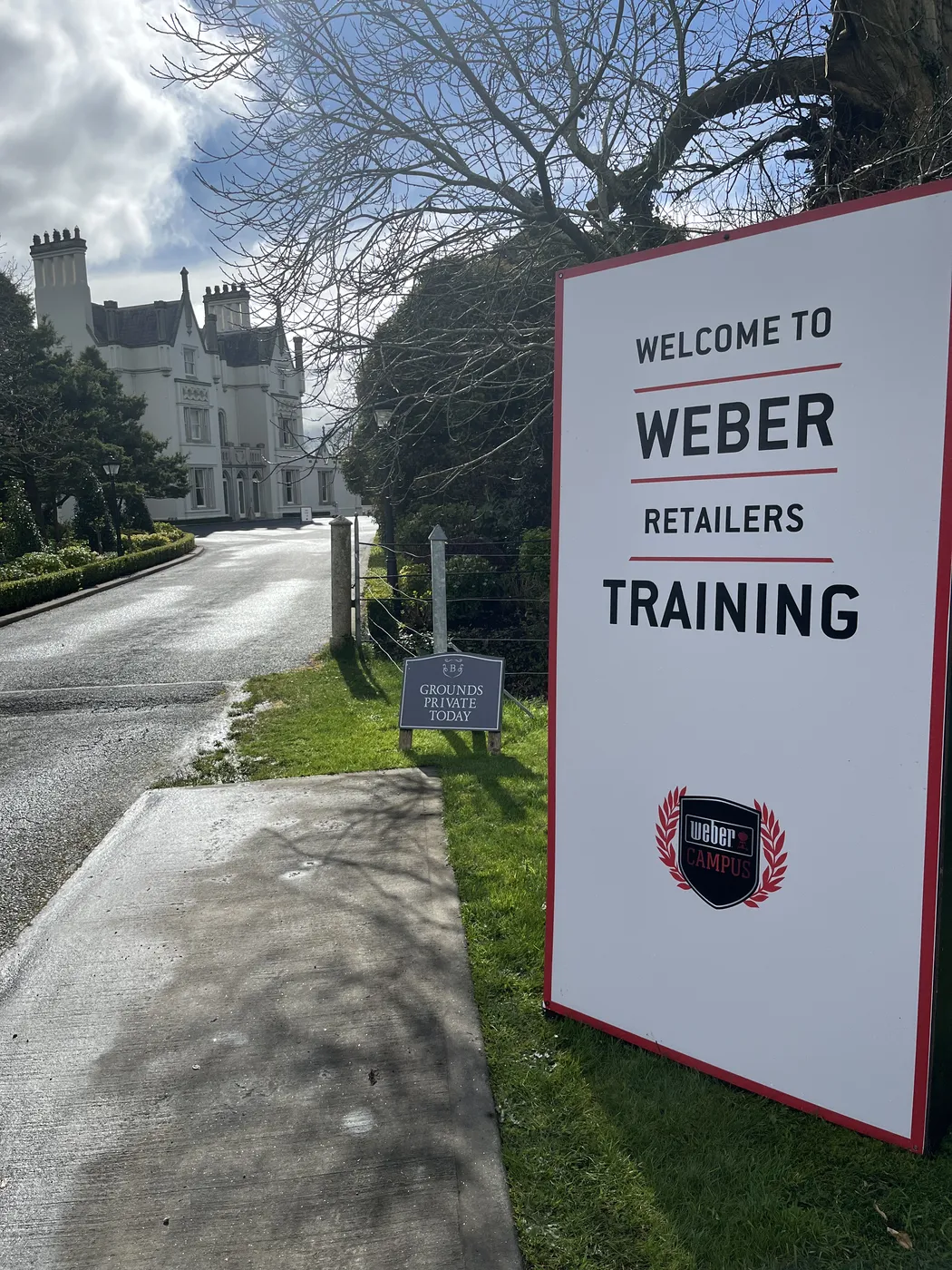 Historic building with a welcoming sign in the driveway for the Weber training event.